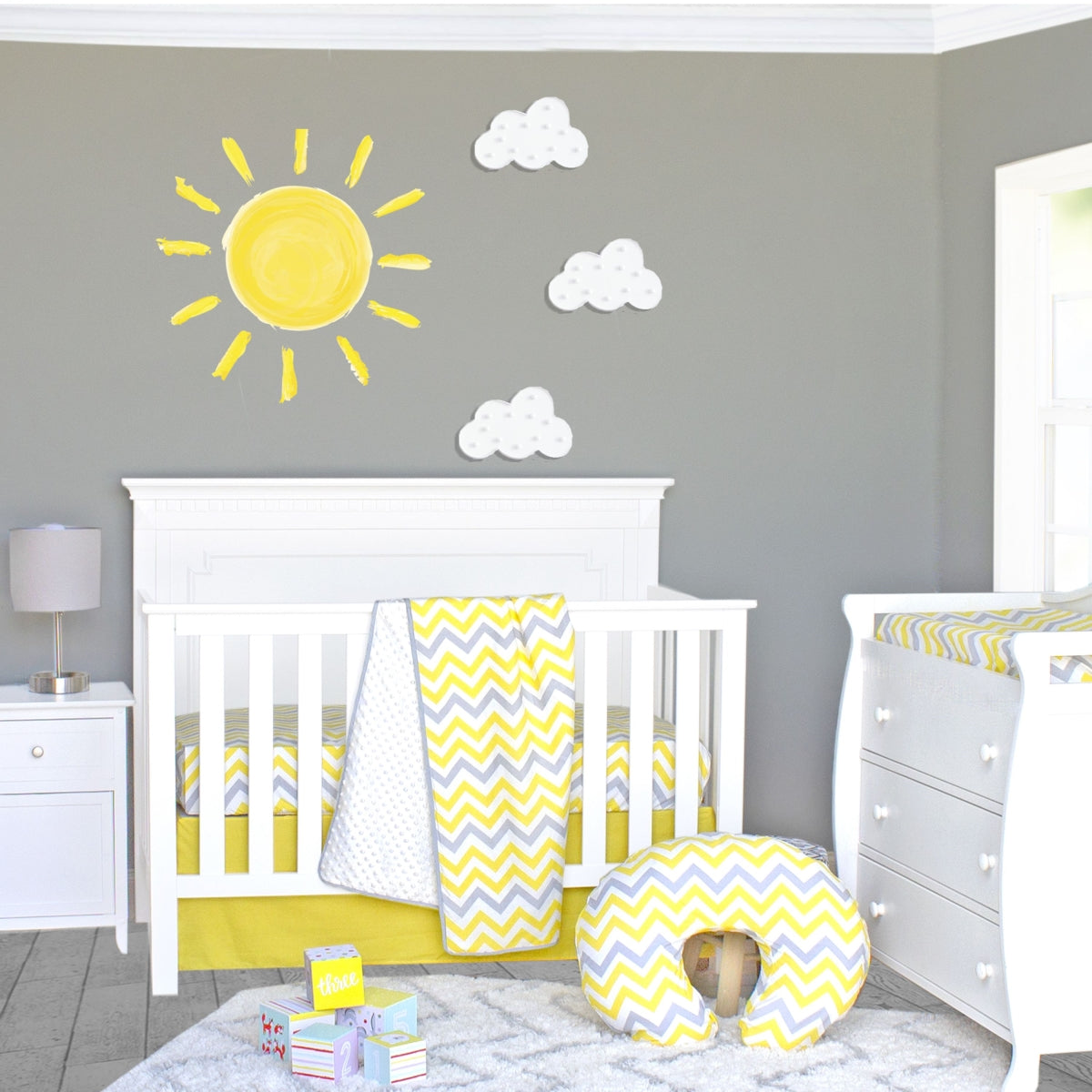 Let the Sunshine In! Our Sunshine 3 Piece Crib Bedding Set is sure to delight your little ray of sunshine! Warm yellow and beautiful grey ray pattern on a soft white background will make your little boy or girl smile from ear to ear. This cheerful set is constructed with an easy-care cotton/poly blend for quick, easy washing when needed. Our set includes Reversible Chenille Dot Blanket, Tailored Crib Skirt and Fitted Crib Sheet. Made with reversible, coordinating pieces..