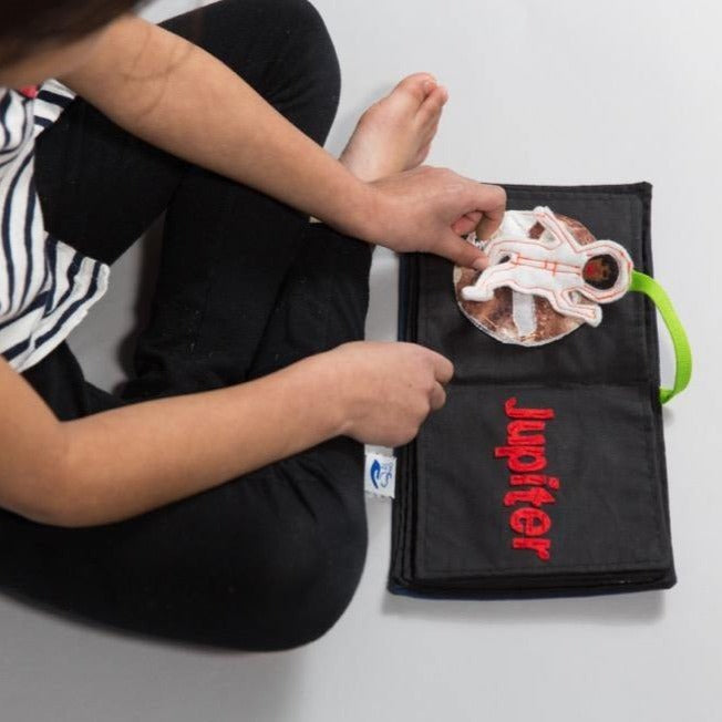 Increase your child’s awareness of their world (and beyond) with the Solar System Book! This book includes a page for each planet and an astronaut piece for play. This toy is a resource to teach children about planets and space, as well as reading and writing. Fun to play with others, or on-the-go; the Solar System Book is a versatile toy you and your child will love!