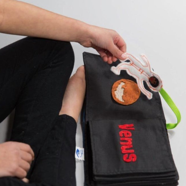 Increase your child’s awareness of their world (and beyond) with the Solar System Book! This book includes a page for each planet and an astronaut piece for play. This toy is a resource to teach children about planets and space, as well as reading and writing. Fun to play with others, or on-the-go; the Solar System Book is a versatile toy you and your child will love!