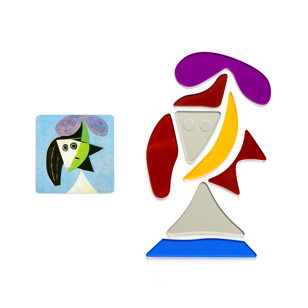 Let children dive into the world of famous artist Pablo Picasso with this set of transparent color shapes depicting three of his famous portraits! Assemble the Portraits  In a set, you will find 33 transparent shapes and 2 cards. These cards will be your guide to assemble the abstract shapes together to make three Picasso portraits: The Woman with the Flower, a Woman with Hat and a Maya in a Sailor Suit. See the world in the eyes of Pablo Picasso!