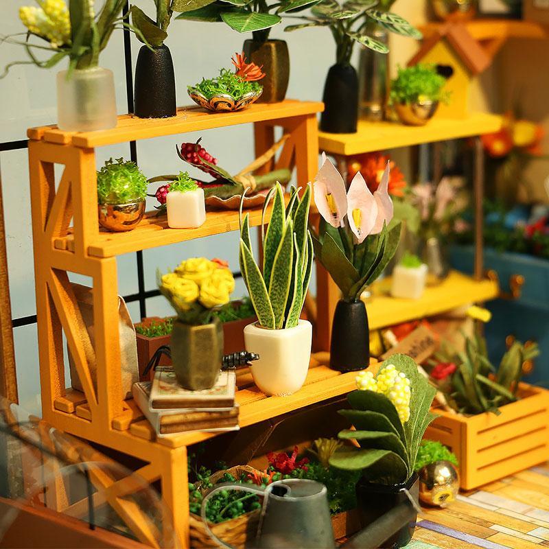 Enjoy the stress-relieving hobby of assembling this DIY Mini Dollhouse, a little greenhouse hideaway for garden enthusiasts or those who wish they had a greener thumb... If you can stand to part with it, give as an impressive and heart-warming gift. It's a very inviting scene to gaze upon.    Details Assembly size: 195*175*175mm  Package size: 319*207*50mm  Wooden pieces: 231pcs